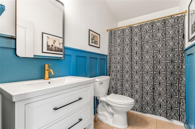 1469 Broken Oak Dr Unit 43A, Winter Garden, FL 34787 - full bathroom featuring toilet, a wainscoted wall, vanity, tile patterned flooring, and a shower with shower curtain