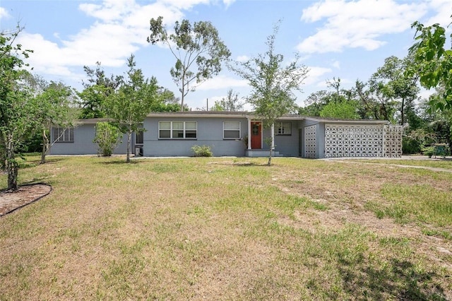 45 S University Cir, Deland, FL 32724 - ranch-style home with a front yard and a garage