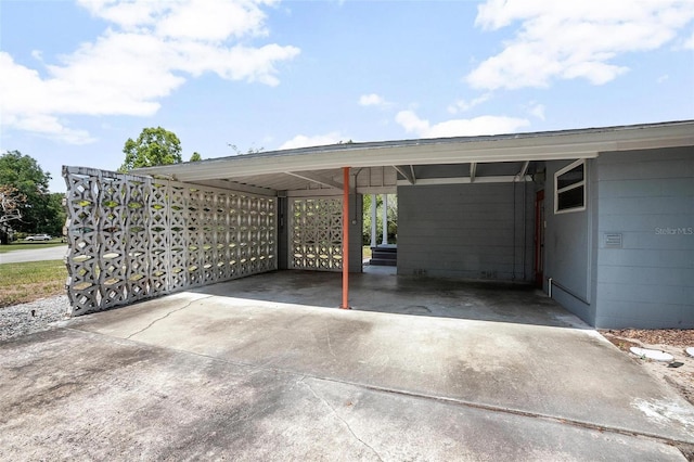45 S University Cir, Deland, FL 32724 - view of vehicle parking with driveway and an attached carport