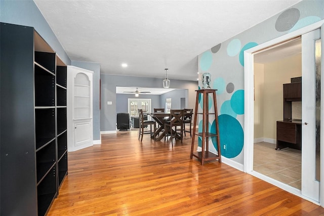 45 S University Cir, Deland, FL 32724 - dining space featuring light wood-type flooring, a ceiling fan, and baseboards