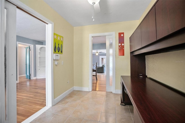 45 S University Cir, Deland, FL 32724 - hall with baseboards and light tile patterned floors