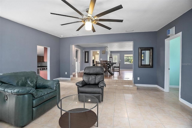 45 S University Cir, Deland, FL 32724 - living area featuring ceiling fan, light tile patterned floors, and baseboards