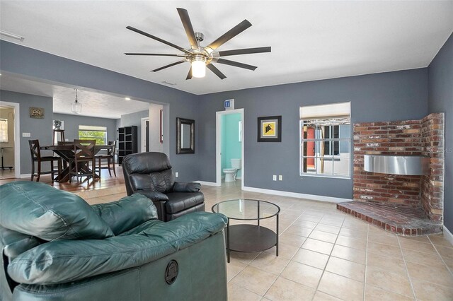 45 S University Cir, Deland, FL 32724 - living room with ceiling fan, baseboards, and light tile patterned flooring