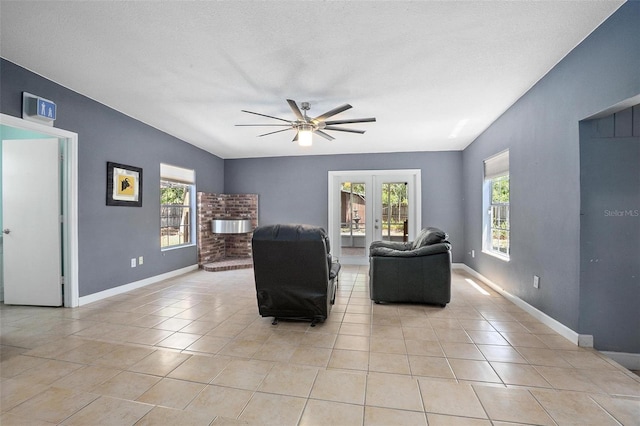 45 S University Cir, Deland, FL 32724 - living room with a ceiling fan, light tile patterned floors, french doors, and baseboards