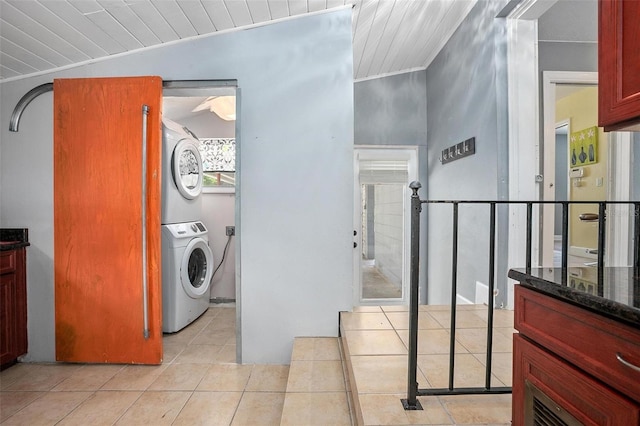 45 S University Cir, Deland, FL 32724 - laundry room with stacked washing machine and dryer, light tile patterned floors, and wood ceiling