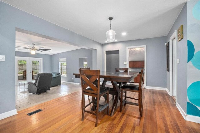 45 S University Cir, Deland, FL 32724 - dining room with baseboards, wood finished floors, and a ceiling fan