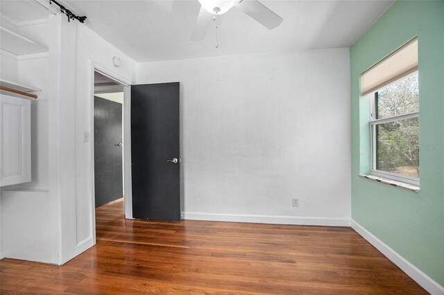 45 S University Cir, Deland, FL 32724 - empty room featuring ceiling fan, wood finished floors, and baseboards