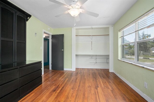 45 S University Cir, Deland, FL 32724 - unfurnished bedroom with a closet, wood finished floors, baseboards, and ceiling fan