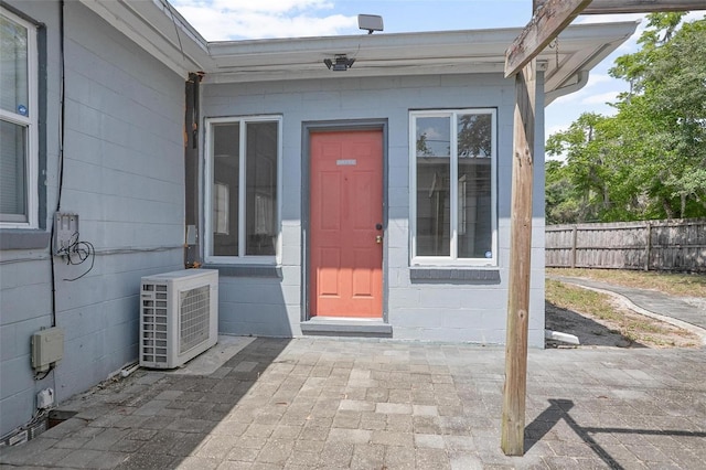 45 S University Cir, Deland, FL 32724 - property entrance with concrete block siding and a patio