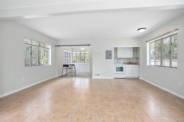 45 S University Cir, Deland, FL 32724 - unfurnished living room with light tile patterned flooring, a sink, baseboards, and electric panel