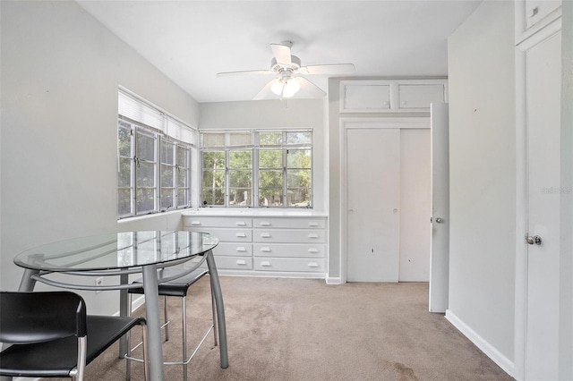 45 S University Cir, Deland, FL 32724 - dining room featuring light colored carpet, a ceiling fan, and baseboards