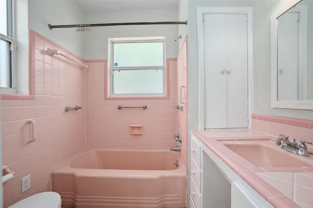 45 S University Cir, Deland, FL 32724 - bathroom with tile walls, vanity, toilet, and shower / bathtub combination