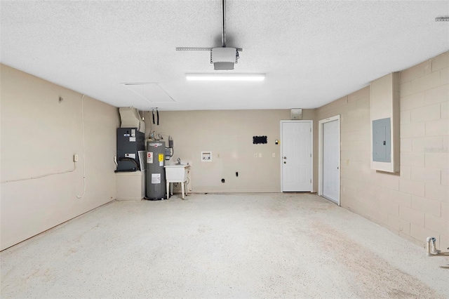 1204 Lawrence Ave, Deltona, FL 32725 - garage featuring water heater, electric panel, heating unit, a garage door opener, and concrete block wall