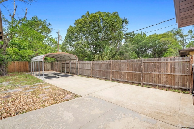 1204 Lawrence Ave, Deltona, FL 32725 - view of patio with a detached carport and driveway