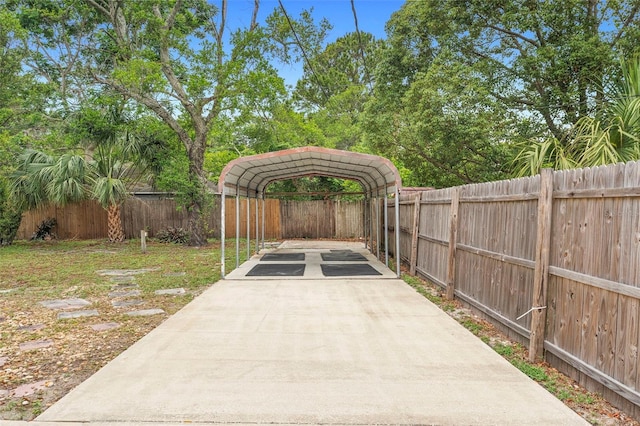 1204 Lawrence Ave, Deltona, FL 32725 - view of patio featuring driveway and a carport