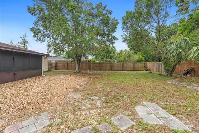 1204 Lawrence Ave, Deltona, FL 32725 - fenced backyard with a sunroom