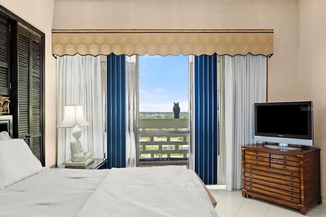 915 Ocean Shore Blvd Unit 8010, Ormond Beach, FL 32176 - bedroom with tile patterned flooring and a closet