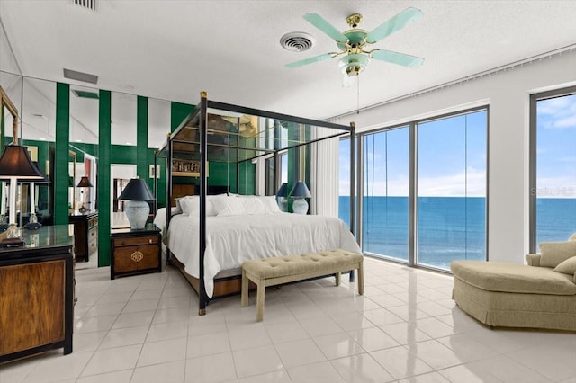 915 Ocean Shore Blvd Unit 8010, Ormond Beach, FL 32176 - bedroom featuring a water view, access to outside, ceiling fan, and light tile patterned floors