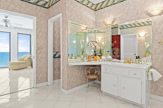 915 Ocean Shore Blvd Unit 8010, Ormond Beach, FL 32176 - bathroom featuring vanity, baseboards, a ceiling fan, an enclosed shower, and tile patterned floors