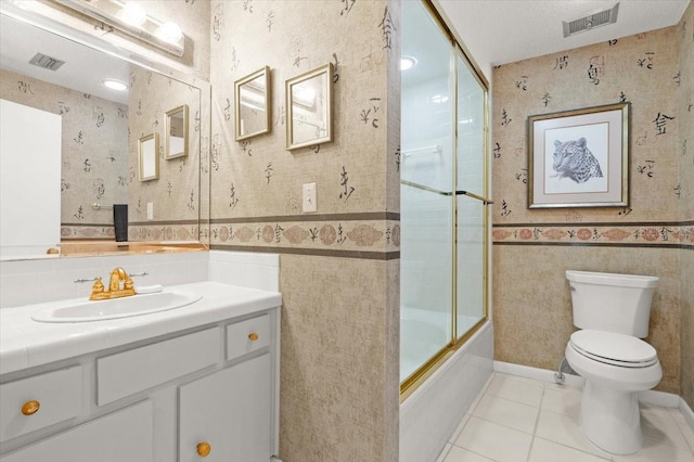 915 Ocean Shore Blvd Unit 8010, Ormond Beach, FL 32176 - full bath with wallpapered walls, toilet, vanity, tile patterned flooring, and enclosed tub / shower combo