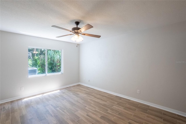 15 Misners Trl, Ormond Beach, FL 32174 - unfurnished room featuring wood finished floors, ceiling fan, and a textured ceiling