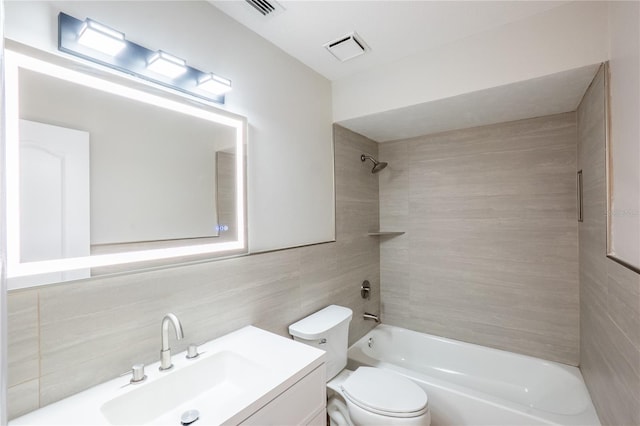 15 Misners Trl, Ormond Beach, FL 32174 - full bath with tile walls, washtub / shower combination, vanity, and tasteful backsplash