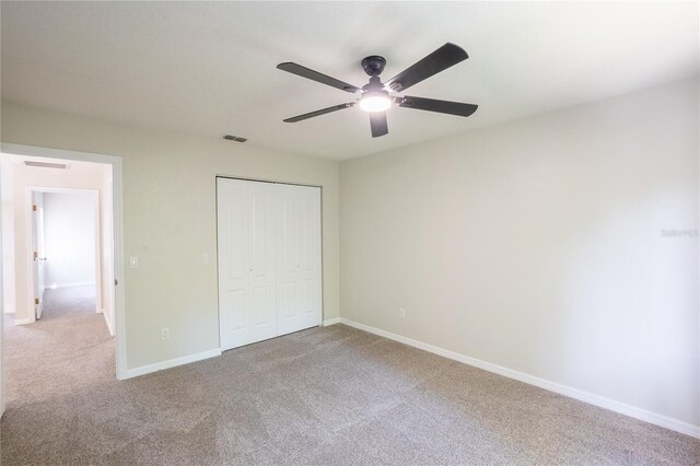 15 Misners Trl, Ormond Beach, FL 32174 - unfurnished bedroom featuring carpet flooring, a closet, and a ceiling fan