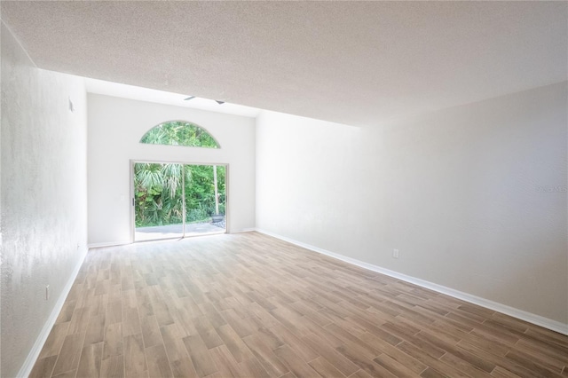 15 Misners Trl, Ormond Beach, FL 32174 - spare room featuring wood finished floors and a textured ceiling