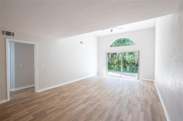 15 Misners Trl, Ormond Beach, FL 32174 - empty room with light wood-style floors, a ceiling fan, and a textured ceiling