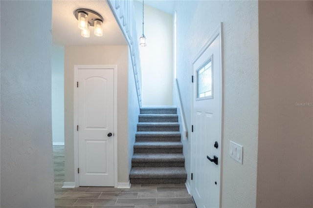 15 Misners Trl, Ormond Beach, FL 32174 - staircase with wood finish floors and a textured wall