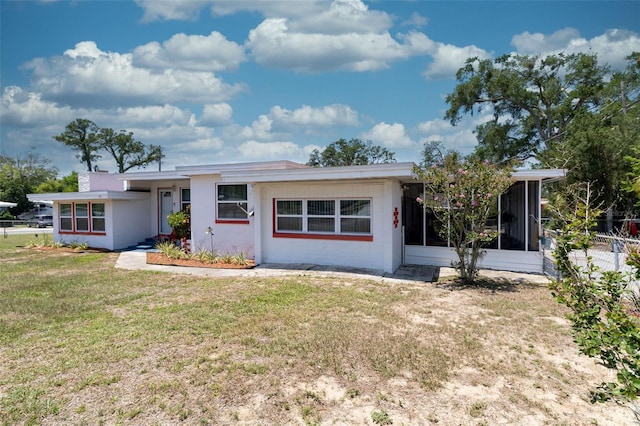 601 Berkshire Rd, Daytona Beach, FL 32114 - ranch-style house with a sunroom and stucco siding