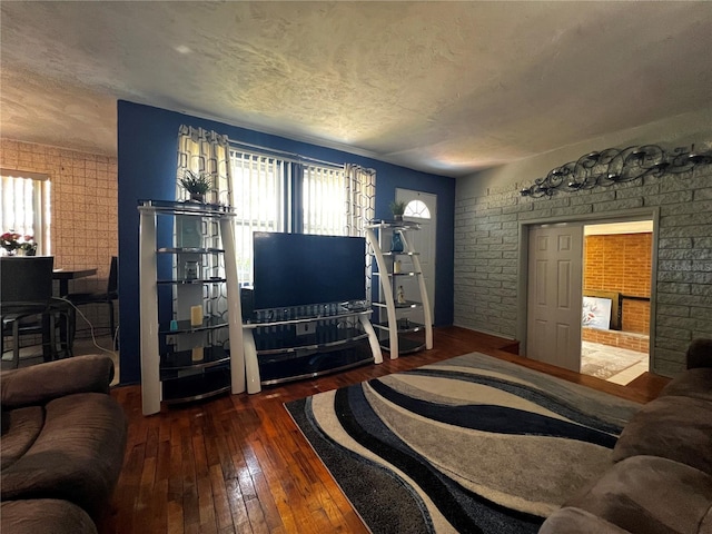 601 Berkshire Rd, Daytona Beach, FL 32114 - living room with hardwood / wood-style floors, plenty of natural light, a textured ceiling, and a fireplace