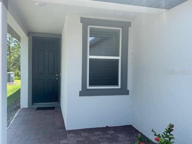 112 Lost Ball Dr, Daytona Beach, FL 32124 - entrance to property with stucco siding and cooling unit