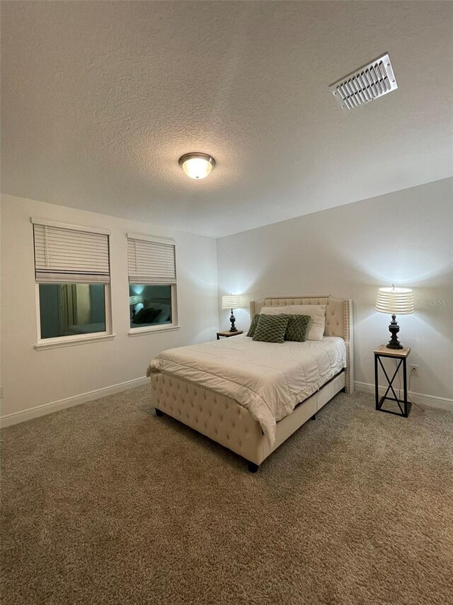 112 Lost Ball Dr, Daytona Beach, FL 32124 - bedroom featuring carpet, a textured ceiling, and baseboards
