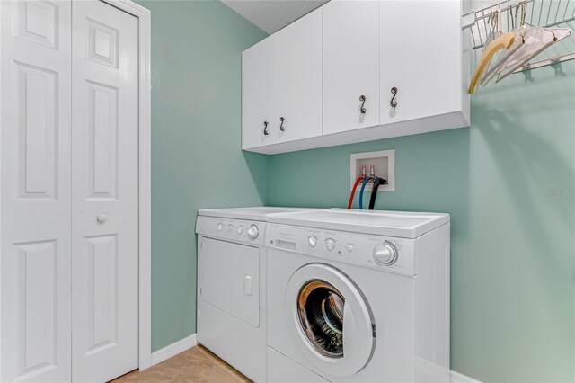 1910 Creekwater Blvd, Port Orange, FL 32128 - laundry room with cabinet space, washer and clothes dryer, and baseboards