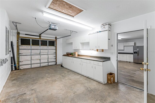 1910 Creekwater Blvd, Port Orange, FL 32128 - garage with stainless steel refrigerator with ice dispenser