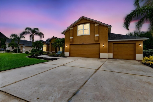 1910 Creekwater Blvd, Port Orange, FL 32128 - view of front of property featuring stucco siding, concrete driveway, a yard, and a garage