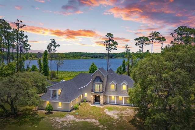 5366 N Lake Farms Rd, De Leon Springs, FL 32130 - view of front facade featuring a balcony and a water view