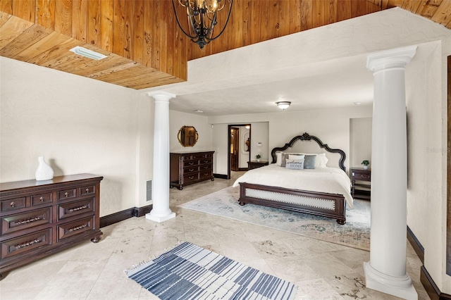 5366 N Lake Farms Rd, De Leon Springs, FL 32130 - bedroom with ornate columns and a chandelier