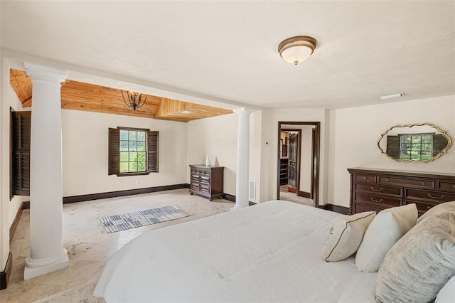 5366 N Lake Farms Rd, De Leon Springs, FL 32130 - bedroom featuring decorative columns and baseboards