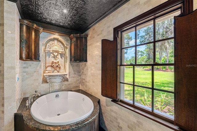 5366 N Lake Farms Rd, De Leon Springs, FL 32130 - full bath featuring a whirlpool tub, tile walls, ornamental molding, and an ornate ceiling