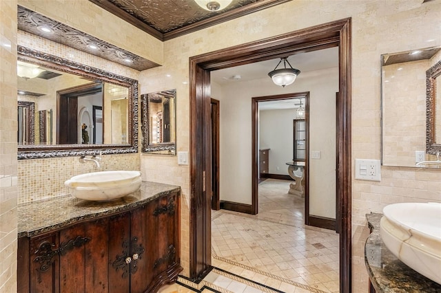 5366 N Lake Farms Rd, De Leon Springs, FL 32130 - bathroom with tile walls, inlaid floor details, vanity, ornamental molding, and tile patterned floors