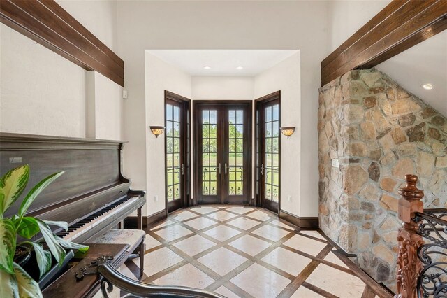 5366 N Lake Farms Rd, De Leon Springs, FL 32130 - foyer entrance with inlaid floor details, plenty of natural light, beamed ceiling, a high ceiling, and recessed lighting