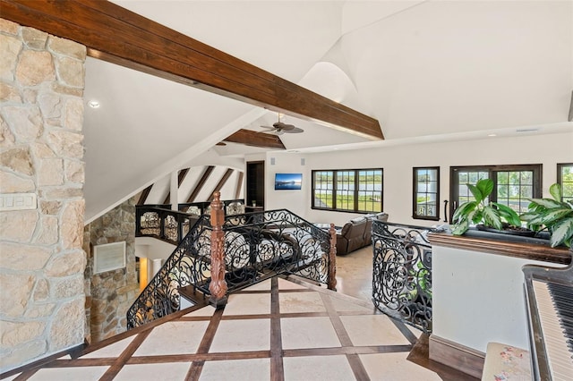 5366 N Lake Farms Rd, De Leon Springs, FL 32130 - stairway with inlaid floor details, ceiling fan, high vaulted ceiling, and beam ceiling