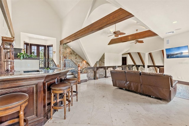 5366 N Lake Farms Rd, De Leon Springs, FL 32130 - indoor dry bar featuring a ceiling fan, beam ceiling, and high vaulted ceiling