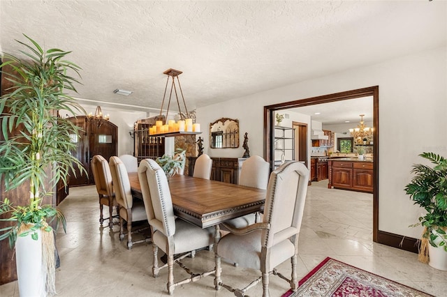 5366 N Lake Farms Rd, De Leon Springs, FL 32130 - dining space with a chandelier and a textured ceiling