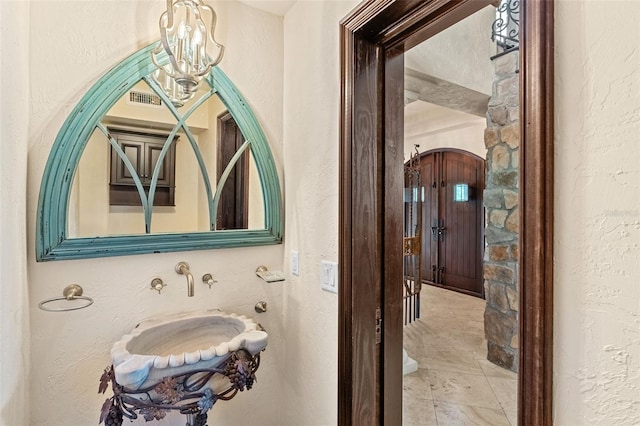 5366 N Lake Farms Rd, De Leon Springs, FL 32130 - bathroom featuring a textured wall and tile patterned flooring