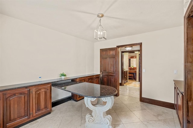 5366 N Lake Farms Rd, De Leon Springs, FL 32130 - dining area with light tile patterned floors and baseboards
