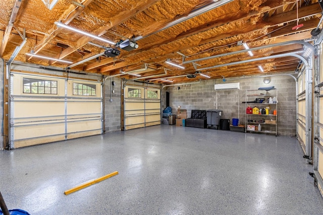 5366 N Lake Farms Rd, De Leon Springs, FL 32130 - garage with a wall mounted AC, concrete block wall, and a garage door opener