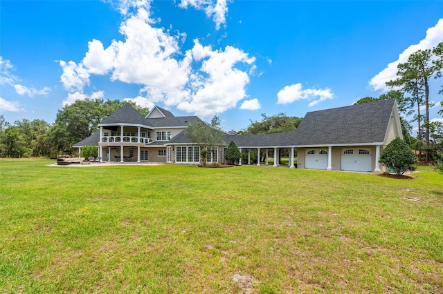 5366 N Lake Farms Rd, De Leon Springs, FL 32130 - rear view of house featuring a lawn, a garage, and a balcony